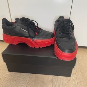 Cardi B/Club C Reebok collab in black and red